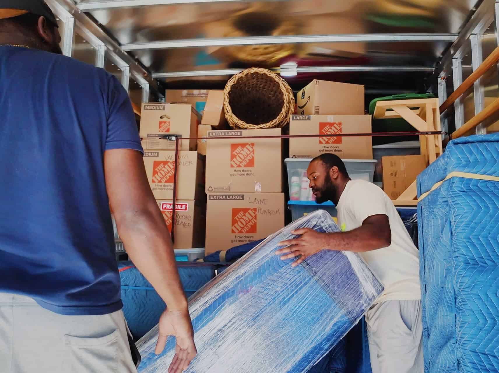MoveCrew Upstate moving truck — pad-wrapped loads, full-time crew